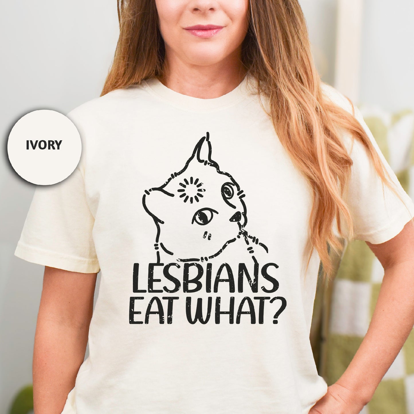 a woman wearing a t - shirt that says lesbians eat what?