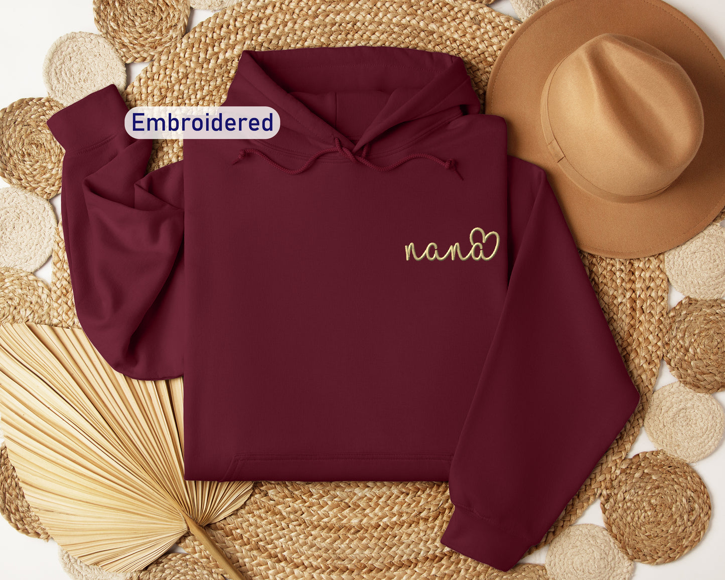 a maroon hoodie with embroidered name on it