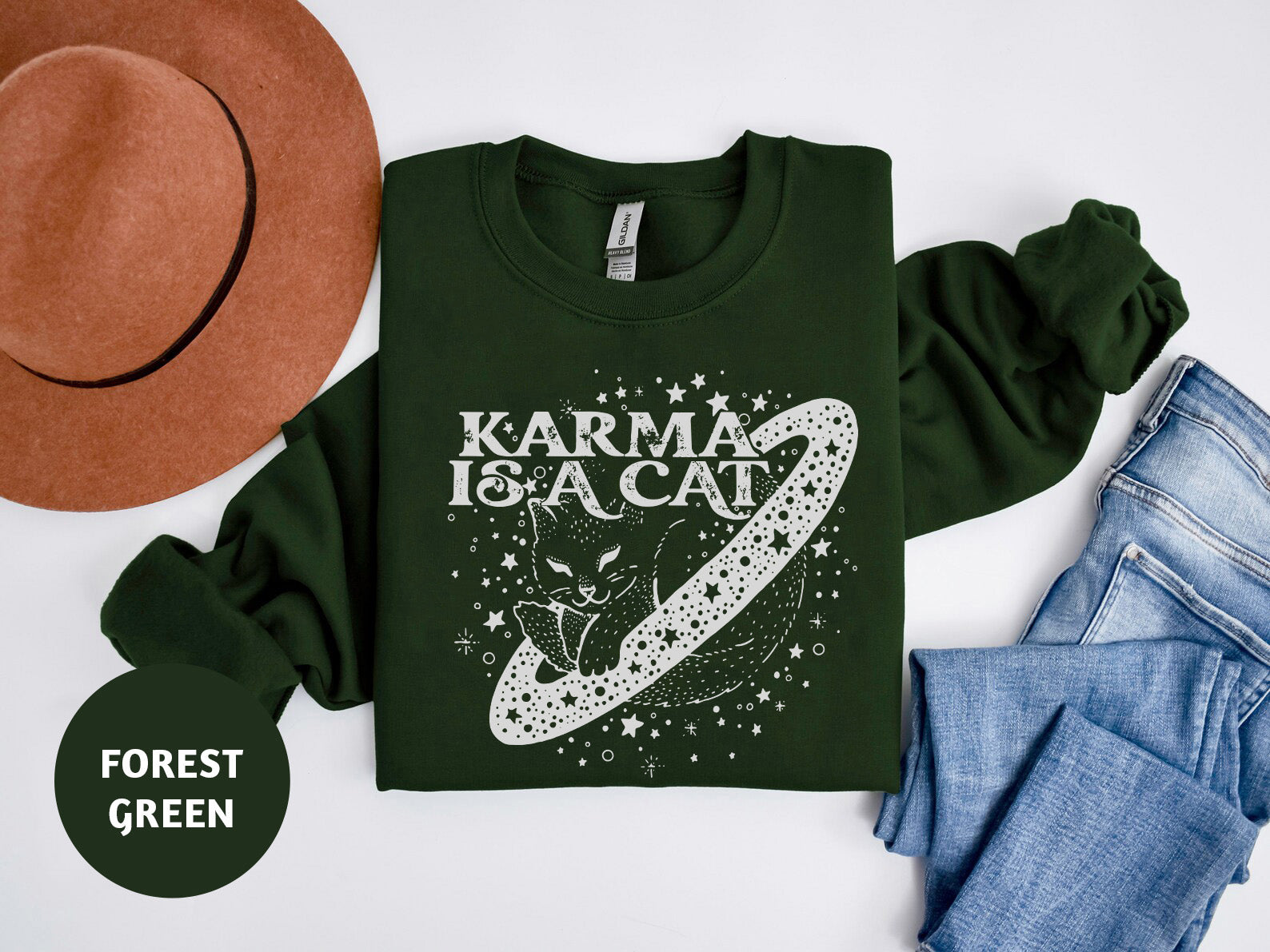 a green t - shirt with the words karma is a cat on it