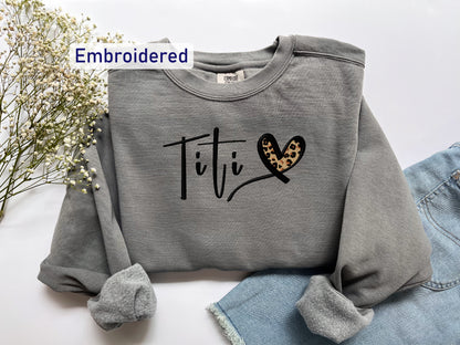 a gray sweatshirt with a leopard print heart on it