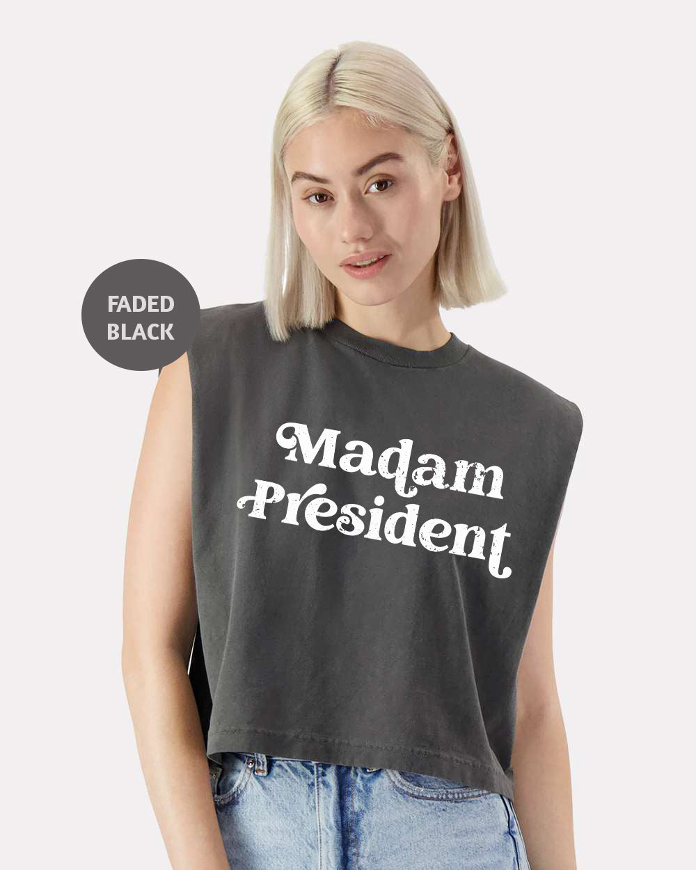 a woman with blonde hair wearing a crop top that says madam president