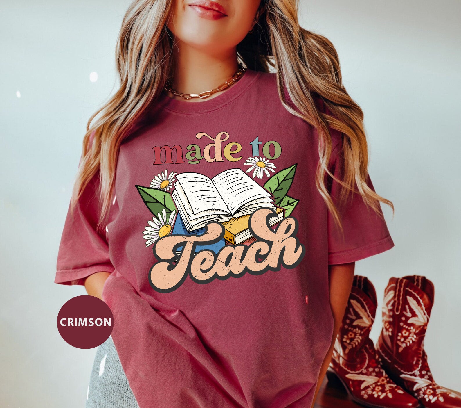 a girl wearing a t - shirt that says made to teach