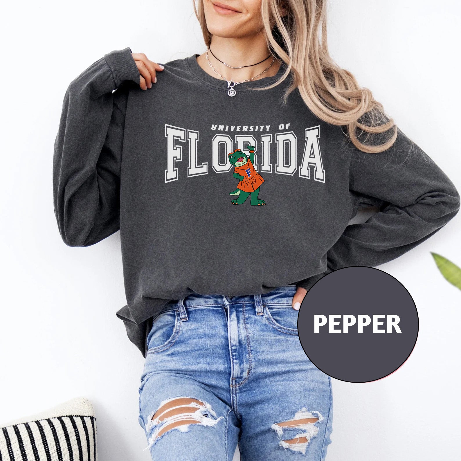 a woman wearing a black sweatshirt with the words florida on it