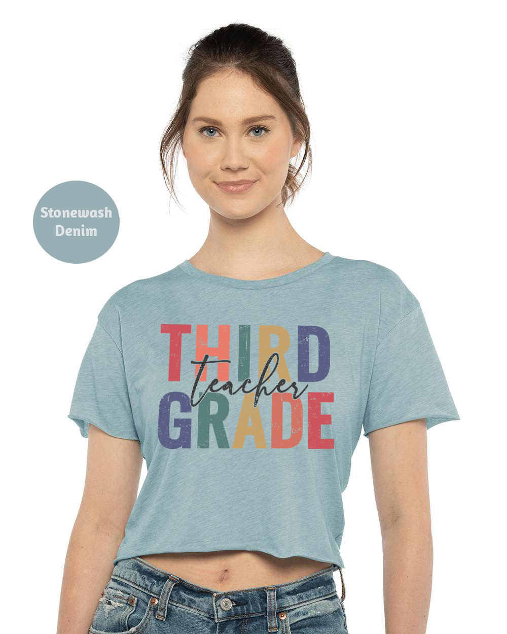 a woman wearing a crop top that says third grade