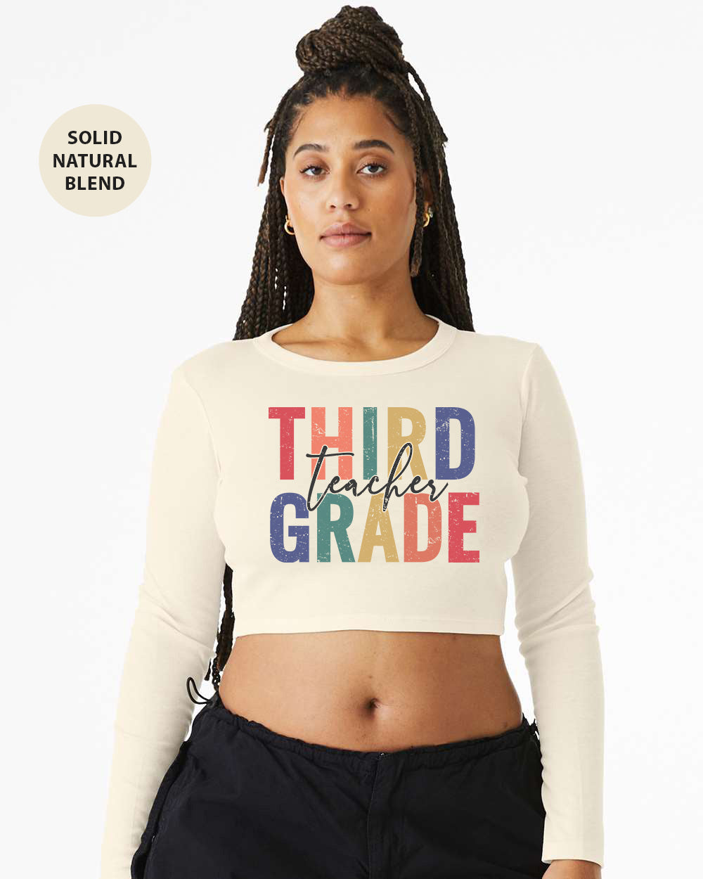 a woman wearing a crop top that says third grade