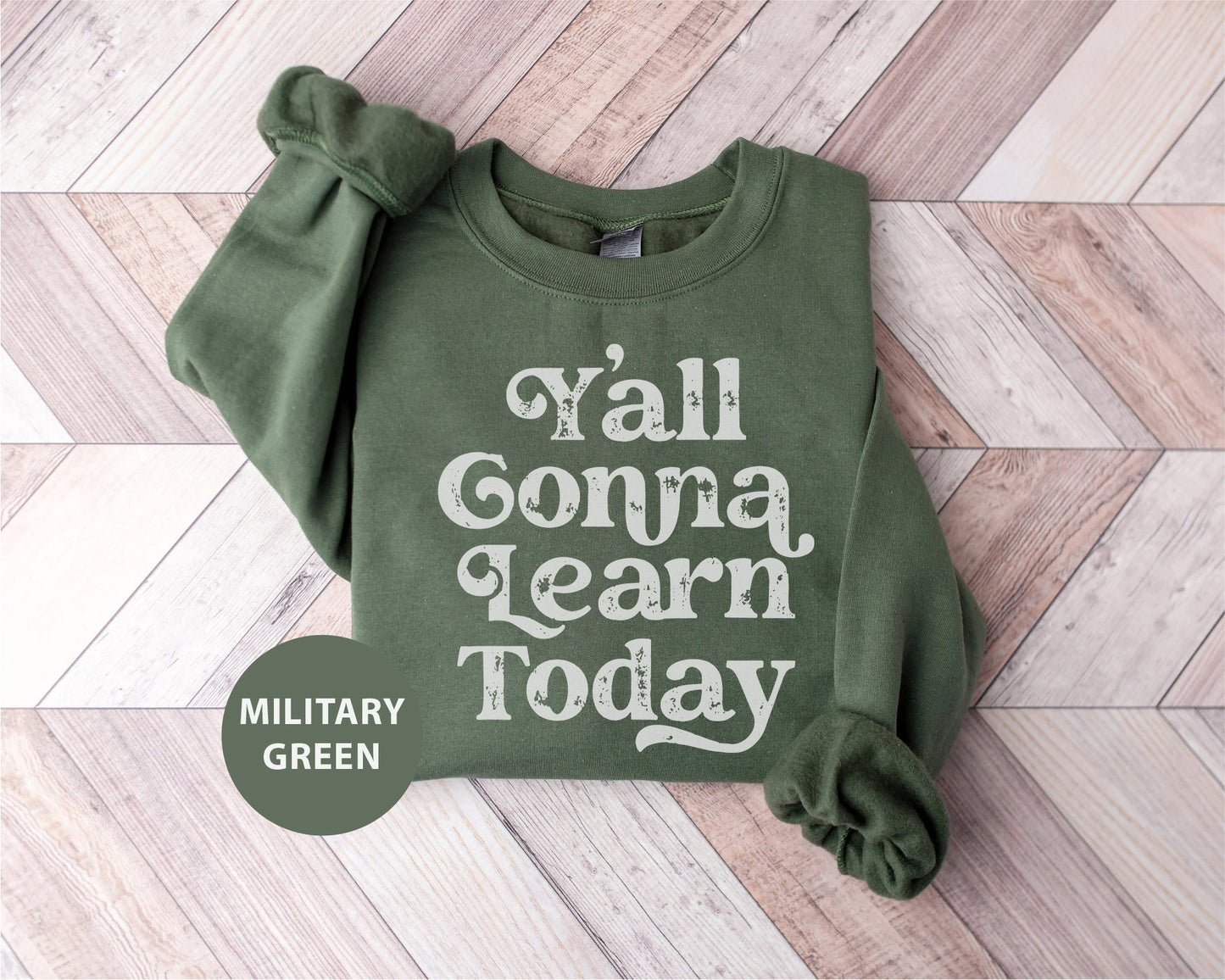 a green sweatshirt with the words y'all gona learn today printed on it