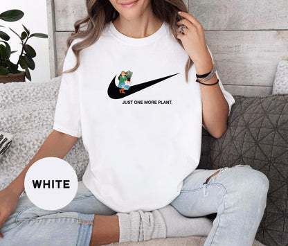 a woman sitting on a couch wearing a white nike shirt