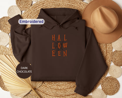 a brown hoodie with the words hal low een on it