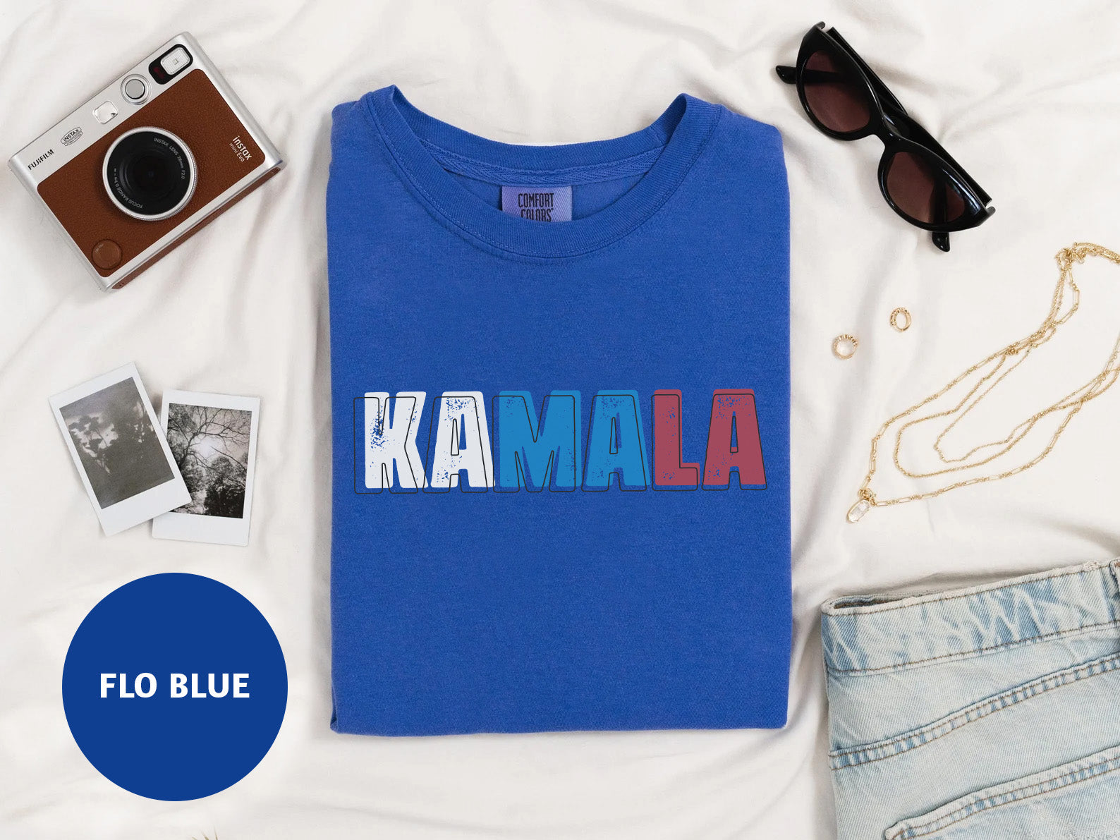 a blue shirt with the word kalamala printed on it