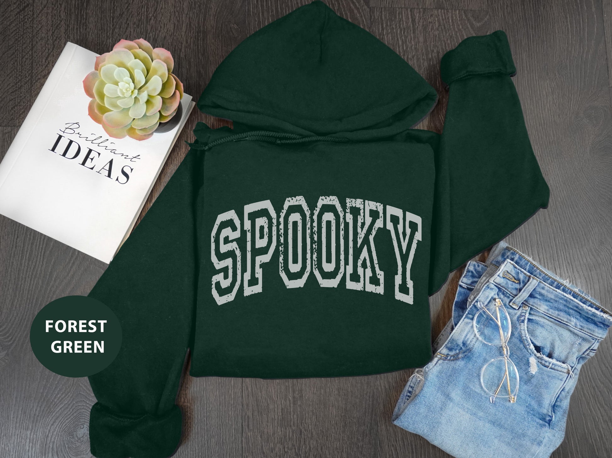 a green hoodie with the word spooky on it