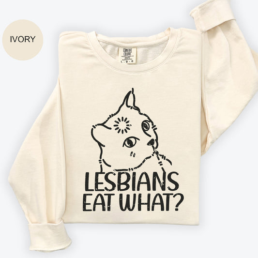 a t - shirt with the words lesbians eat what? on it