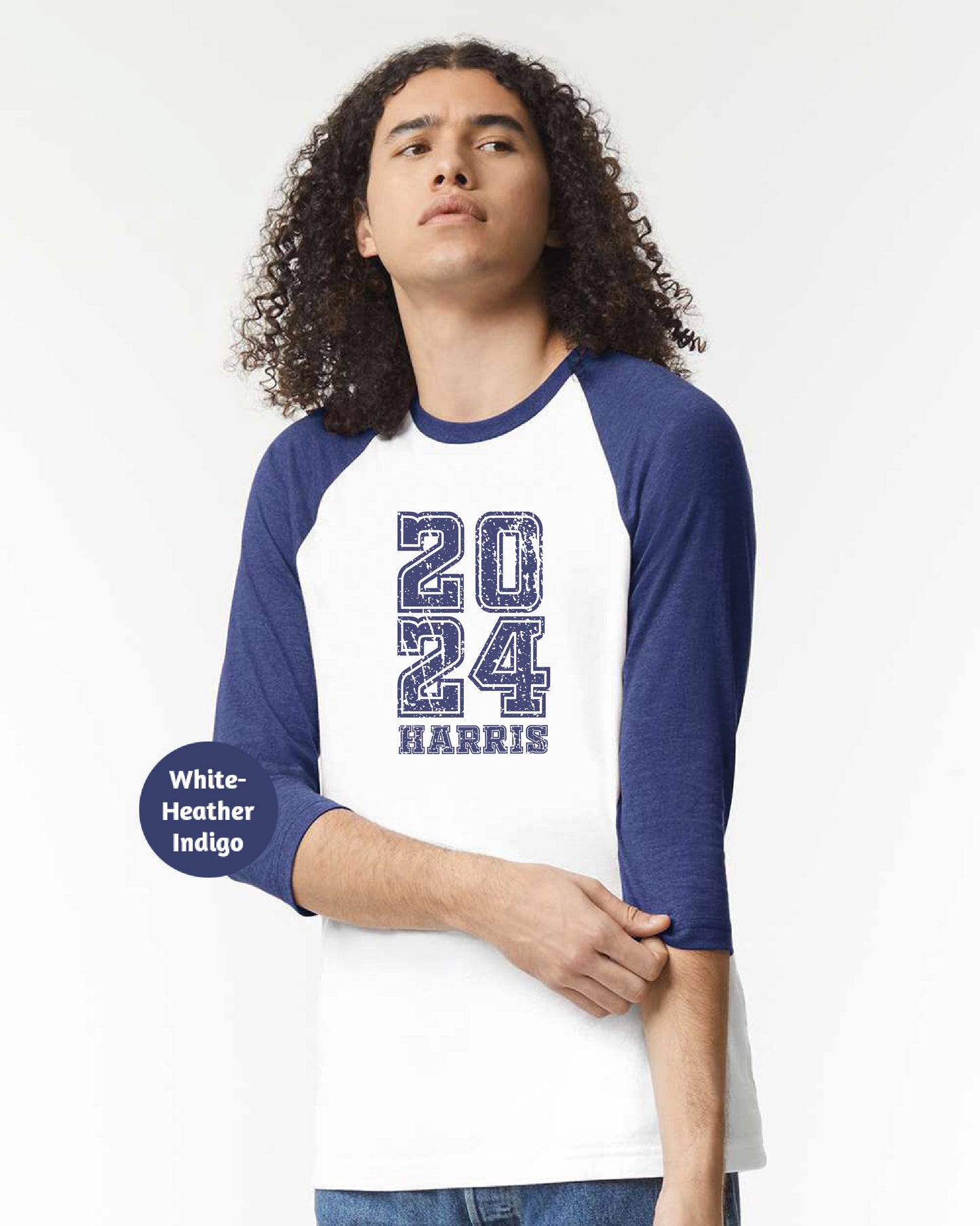 a young man wearing a white and blue baseball shirt