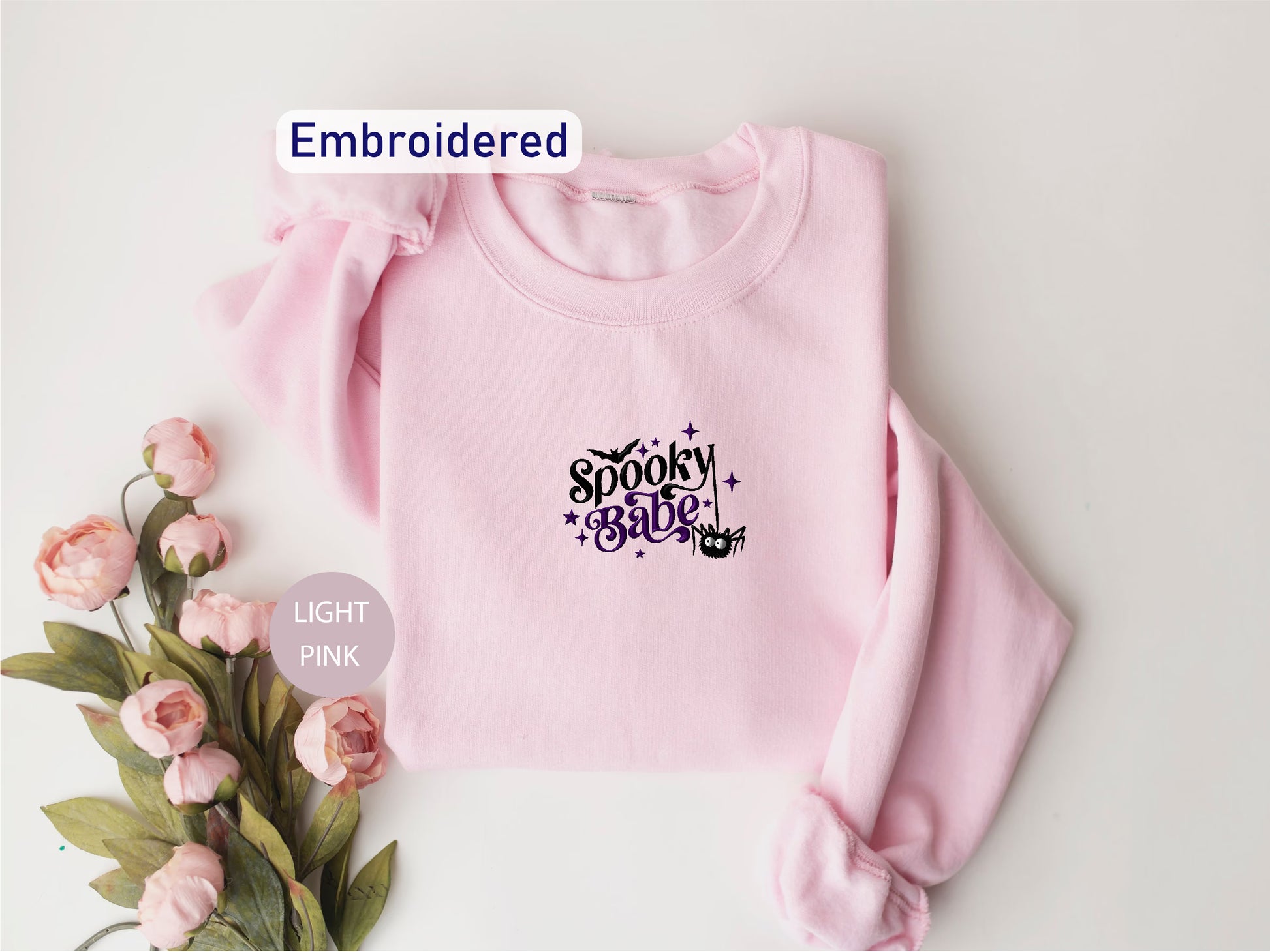 a pink sweatshirt with the words spooky bitch on it