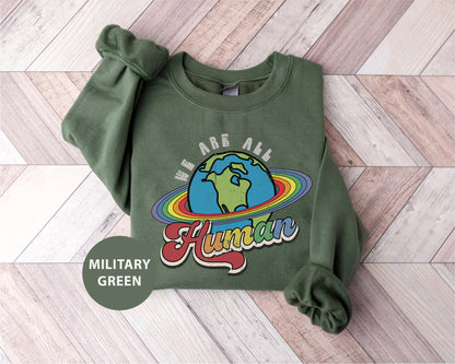 a green sweatshirt with a picture of the earth on it