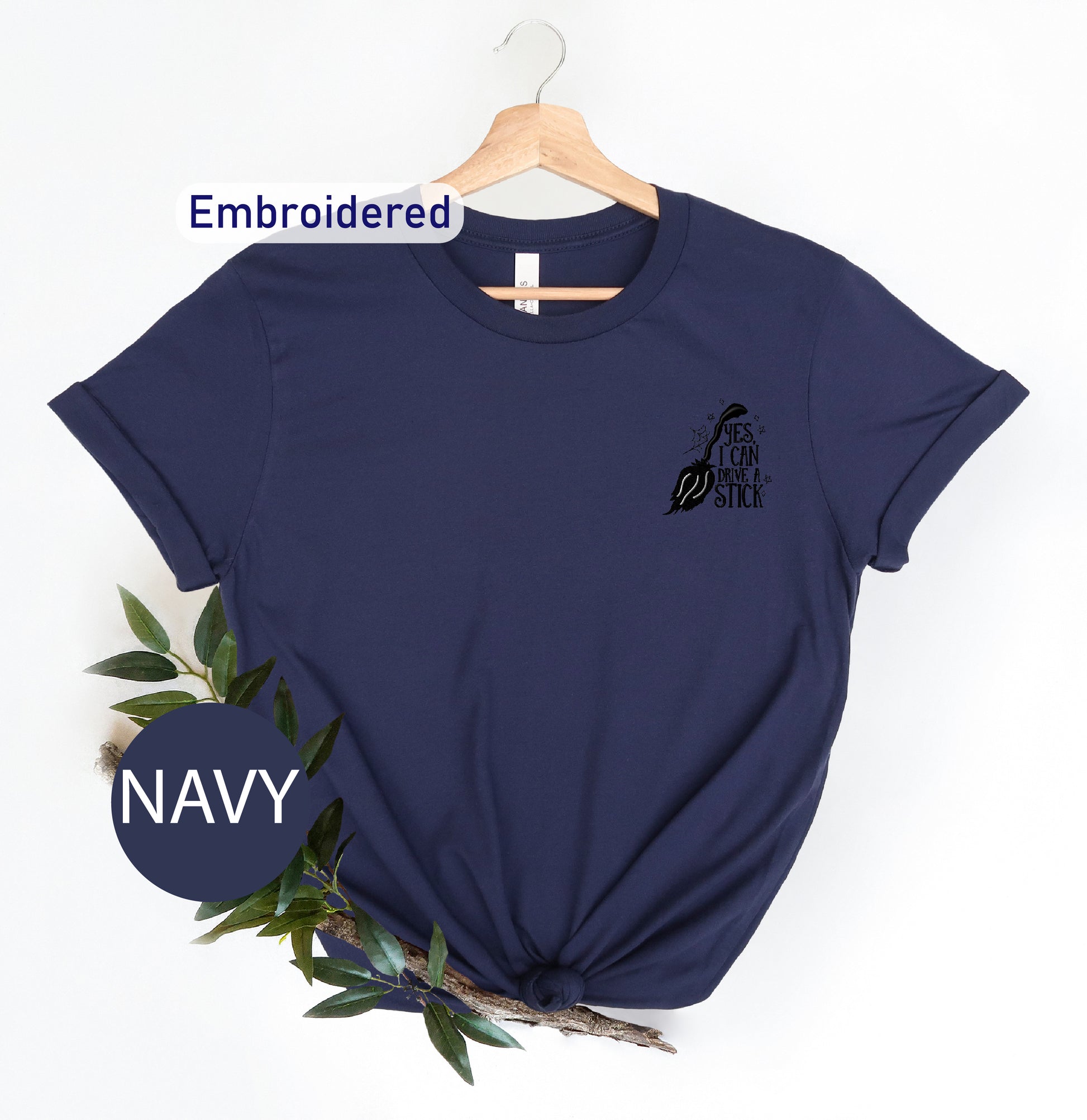 a navy t - shirt with the navy embroidered on it