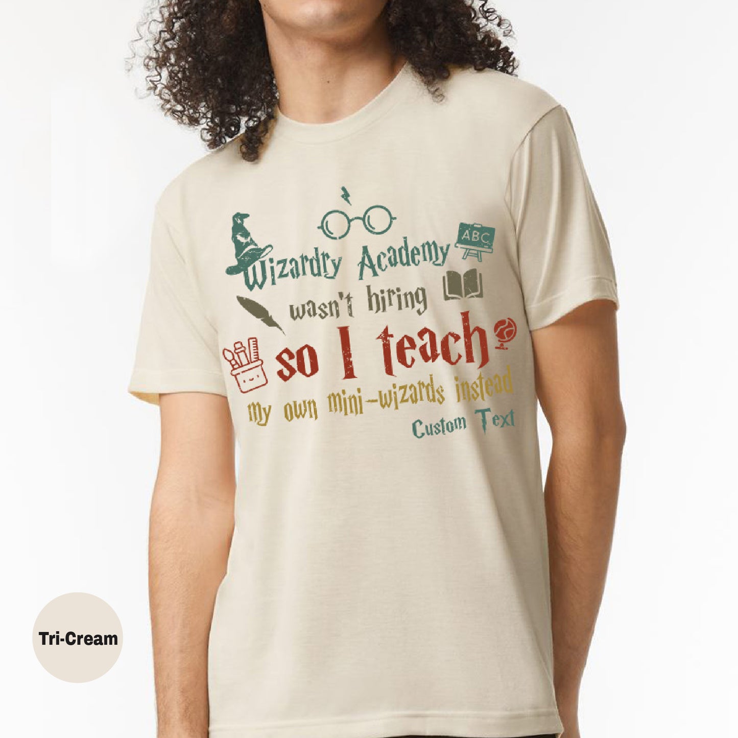 a man wearing a t - shirt that says wizard academy