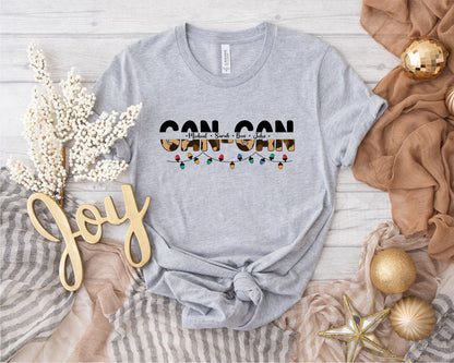 a gray t-shirt with a graphic design, a gold star, and some decorative elements such as a gold star, a gold ball, and a gold ribbon.