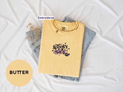 a t - shirt with the words butter on it next to a pair of jeans