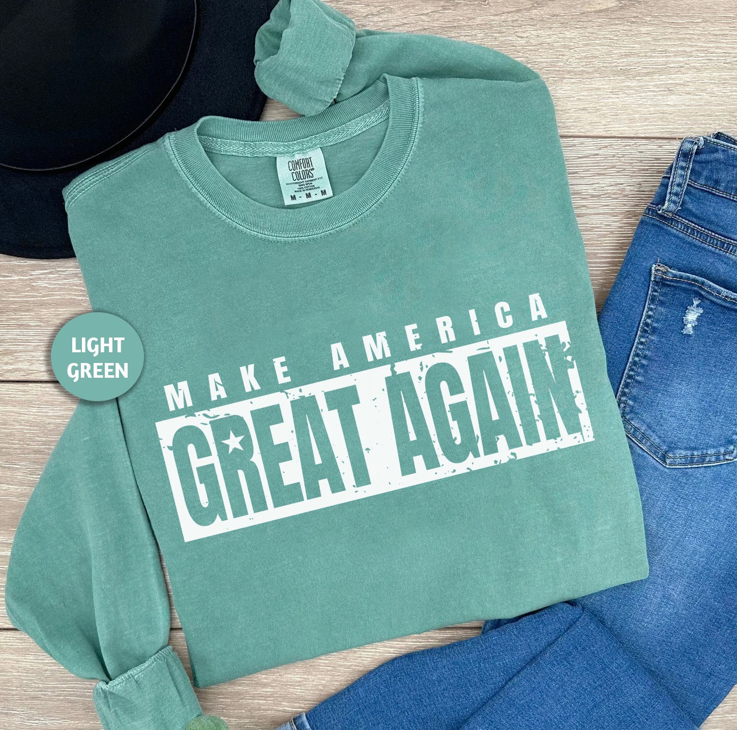 a green shirt that says make america great again