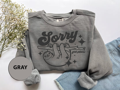 a gray sweatshirt with a picture of a cartoon character on it