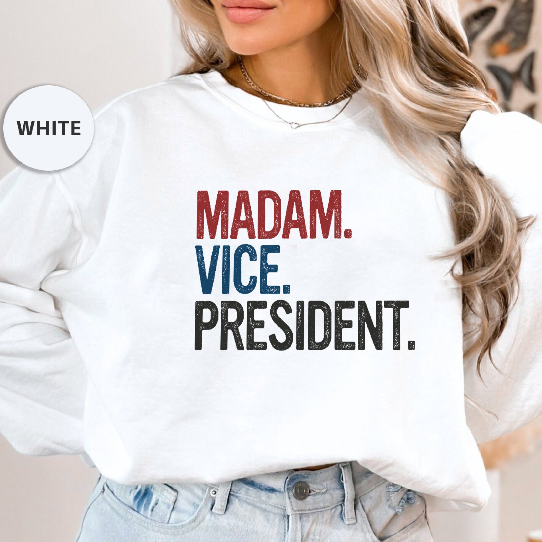 a woman wearing a sweatshirt that says madam vice president