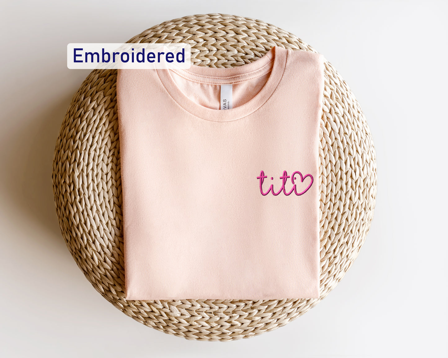 a pink t - shirt with the word ted embroidered on it