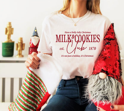 a woman sitting on a couch holding a christmas stocking