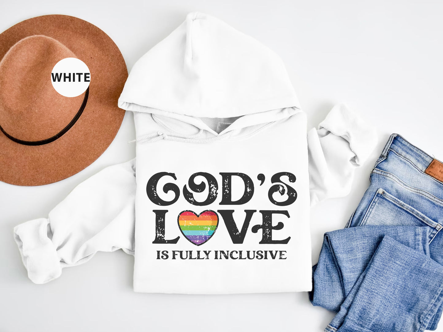 a white hoodie with a rainbow heart and god's love is fully inclusive