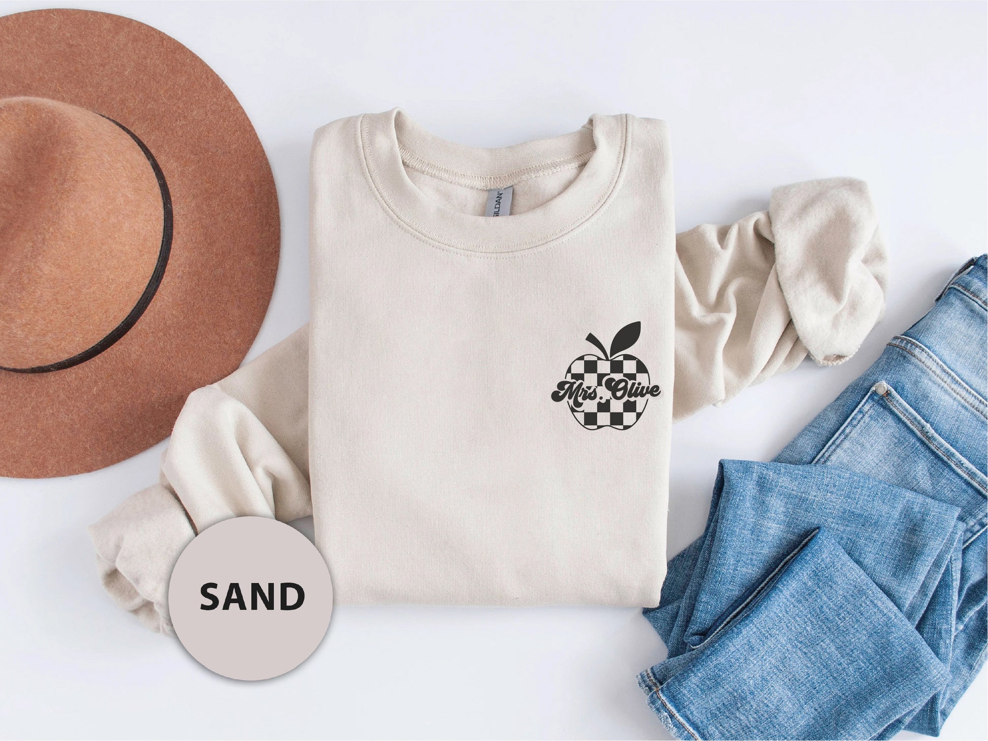 a hat, sweater, jeans, and a hat on a white background