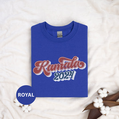 a blue kansas t - shirt sitting on top of a white blanket