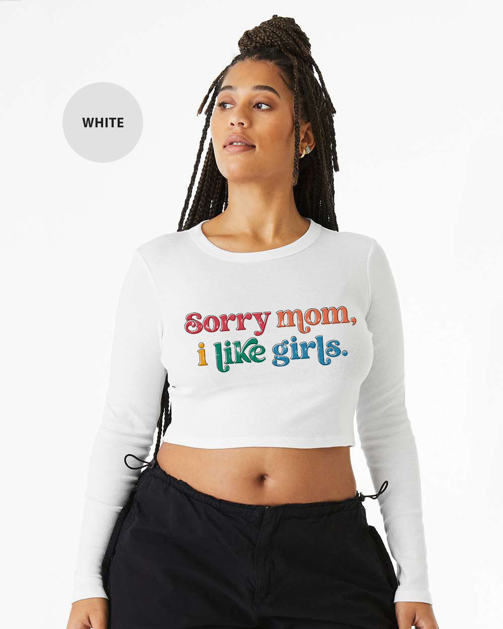 a woman wearing a white crop top that says sorry mom i like girls