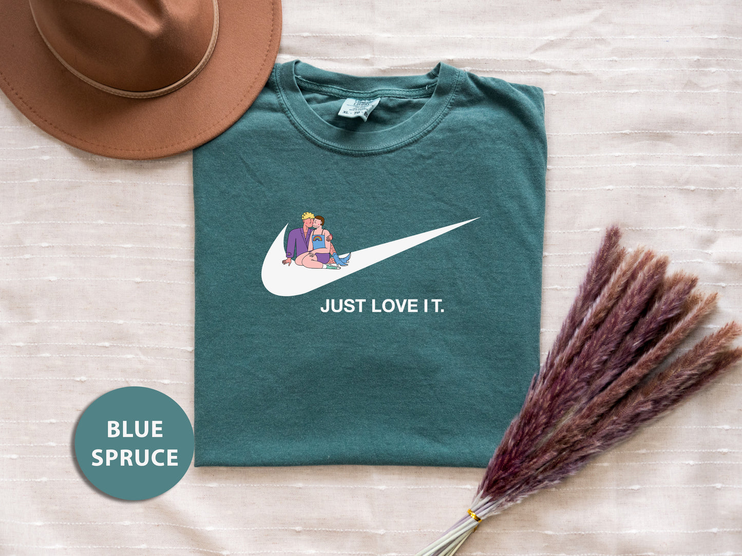 a t - shirt that says just love it and a hat next to it