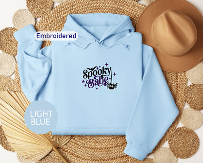 a light blue hoodie with the words spooky purple on it