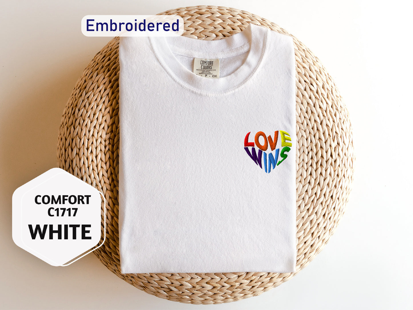 a white t - shirt with the words love is written on it