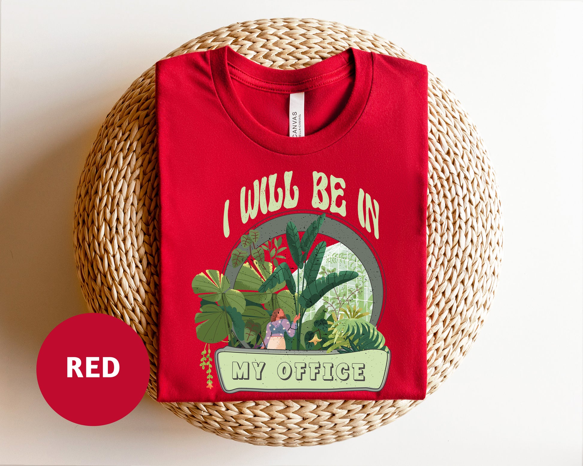 a red t - shirt with a picture of a house plant on it