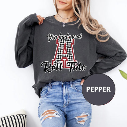 a woman wearing a sweatshirt with the letter a on it