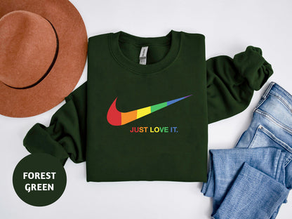 a green shirt with a rainbow nike logo on it