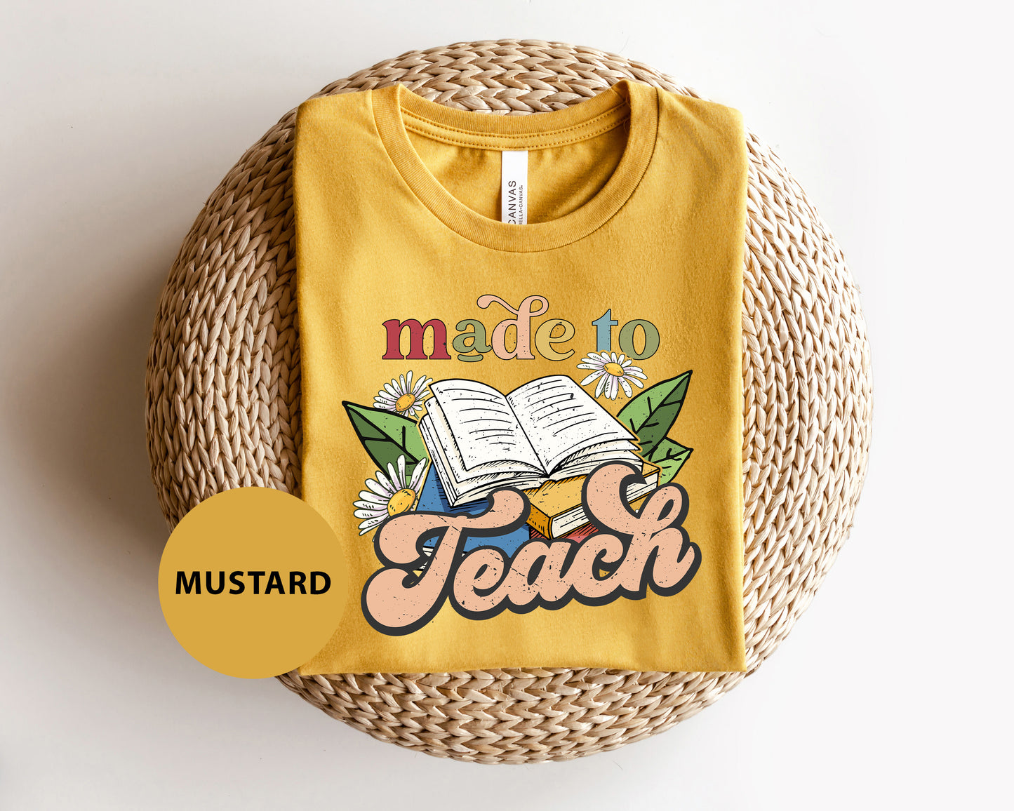 a yellow t - shirt with a picture of a book on it