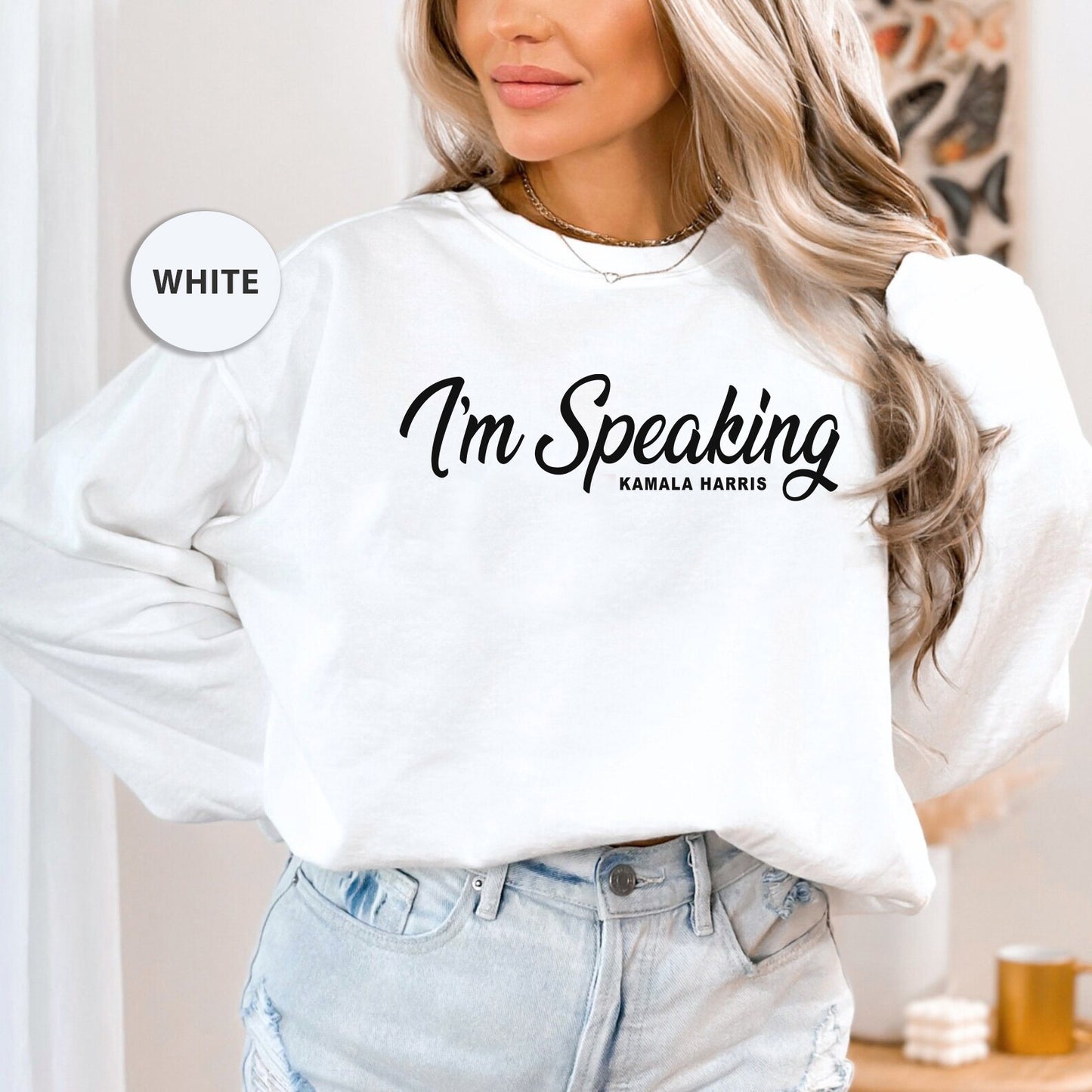 a woman wearing a white sweatshirt that says i'm speaking