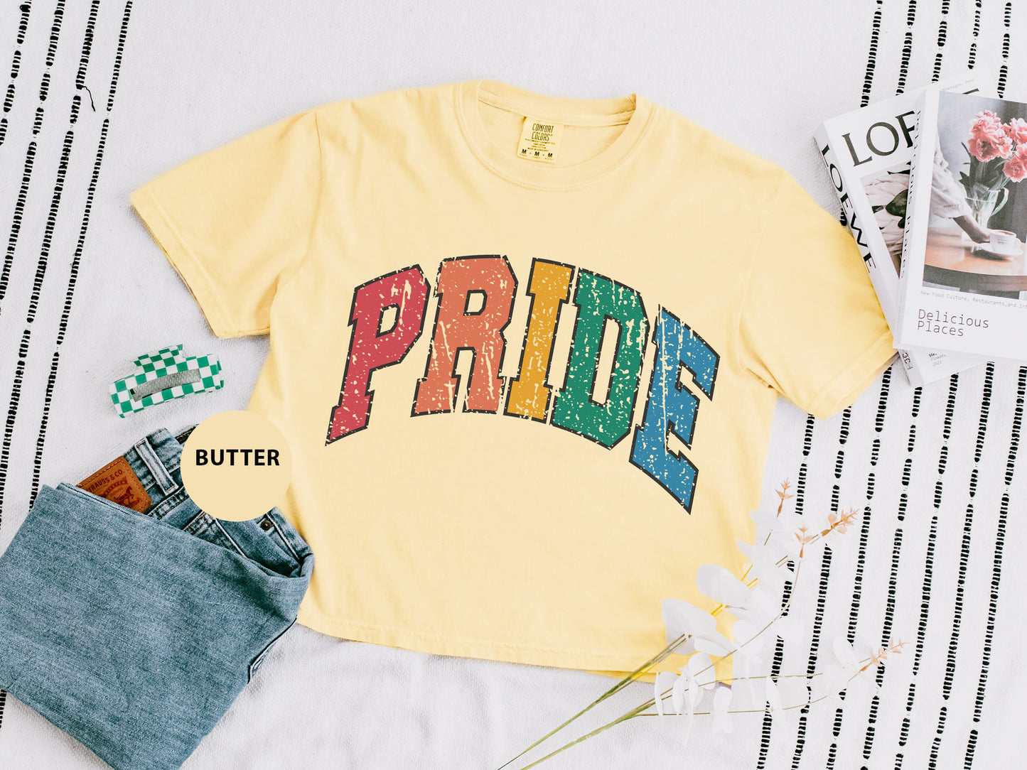 a yellow shirt with the word pride on it