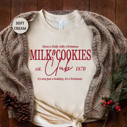 a white t - shirt with the words milk and cookies club on it