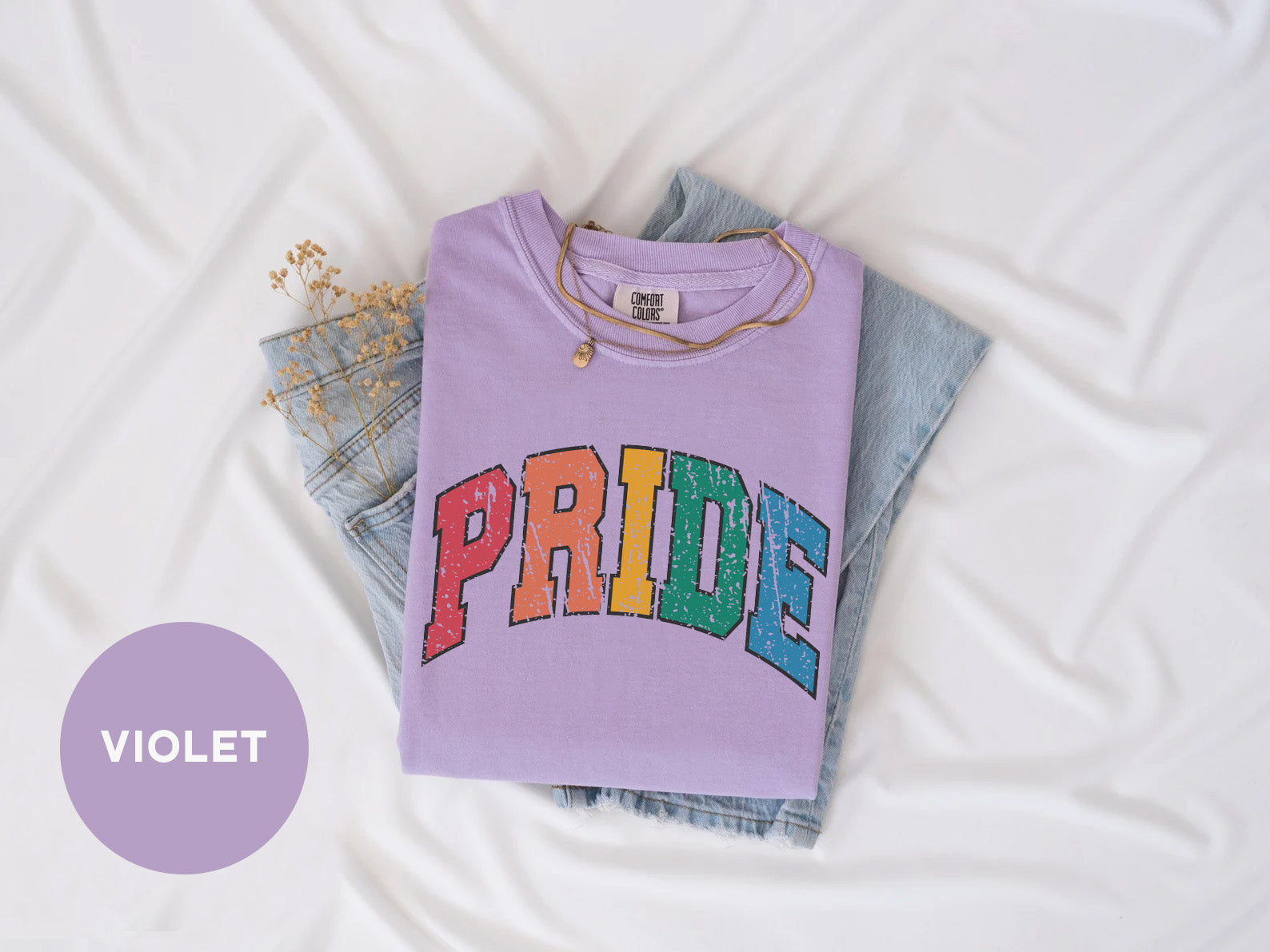 a purple shirt with the word pride on it