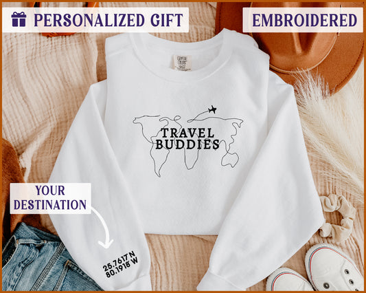 a white sweatshirt with the words travel buddies on it