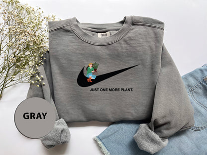 a gray sweatshirt with a cartoon character on it