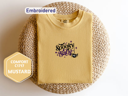 a yellow t - shirt with the words spooky stuff on it