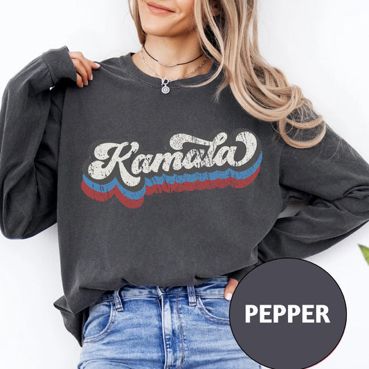 a woman wearing a sweatshirt with the words kansas on it