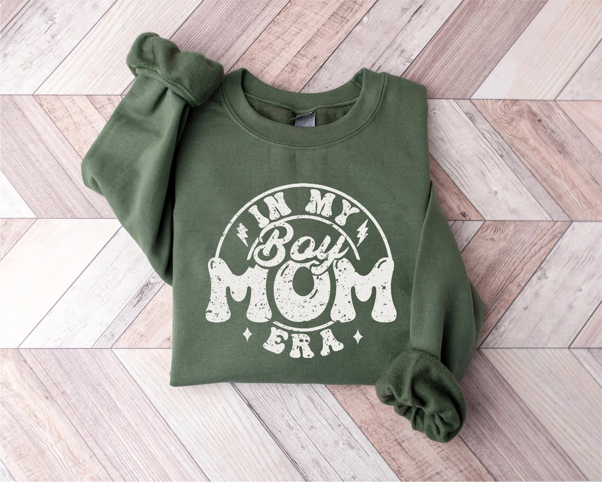 a green sweatshirt with the words mom on it