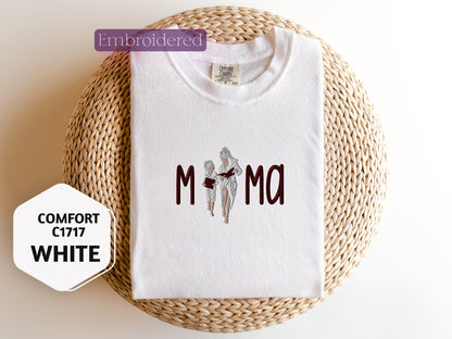 a white t - shirt with the word mom on it