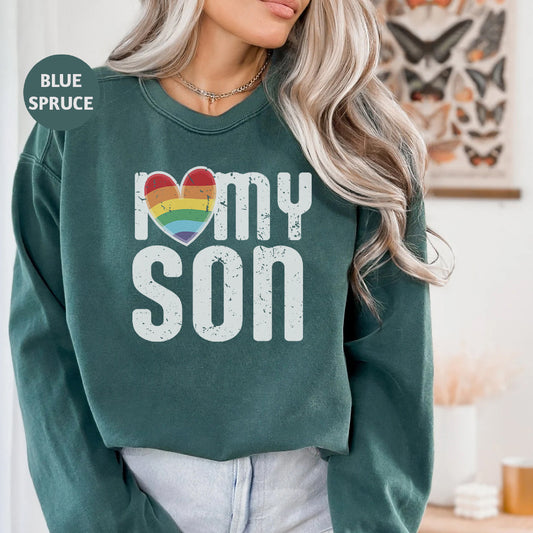 a woman wearing a sweatshirt that says i love my son