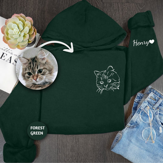 a green hoodie with a picture of a cat on it